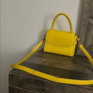 Vibrant Yellow Mini Bag with Top Handle and Flap Closure